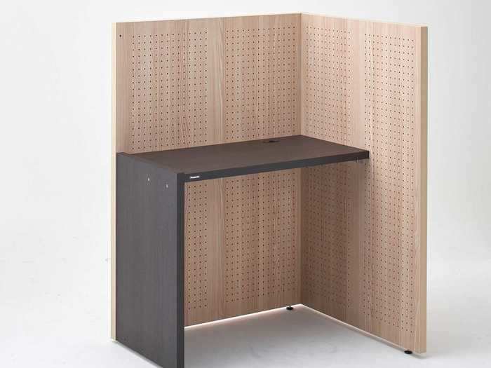 The design is very basic; just a desk and a two-sided partition.