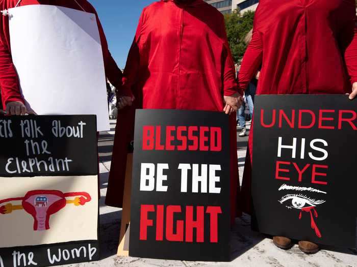 Demonstrators donned 'Handmaid's Tale' costumes, referring to their belief that Barrett's confirmation to the Supreme Court will limit women's rights.