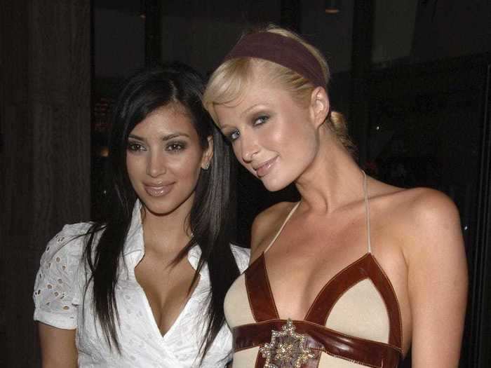 In one of her first red-carpet appearances, Kim Kardashian wore a white lace dress and posed with Paris Hilton at the premiere of HBO's "Entourage" in June 2006.