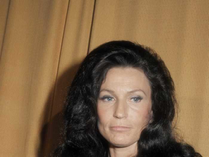 Loretta Lynn attended the 1972 CMA Awards in a navy gown with a sparkly silver top.