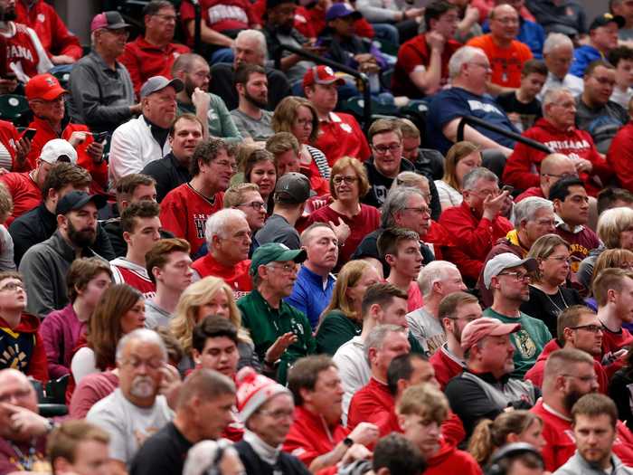 People attended events mask-less and in non-socially-distanced crowds, such as Big Ten Tournament game.