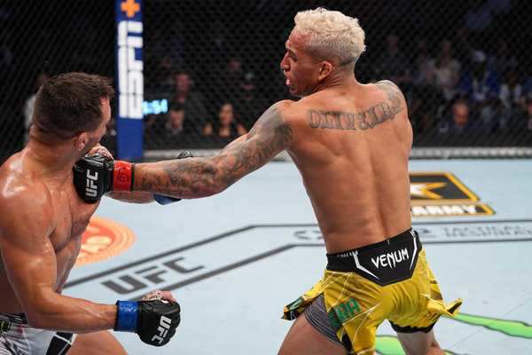 Charles Oliveira overcomes early scare to finish Michael ...