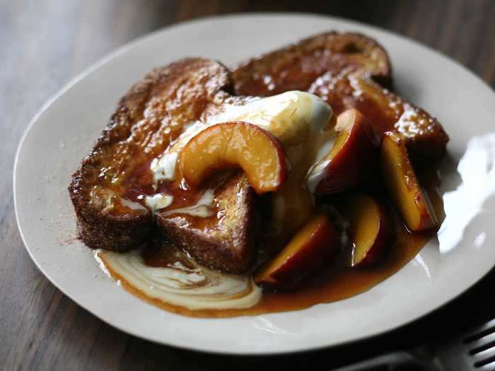 Give your French toast an even sweeter twist by adding cinnamon and caramelized peaches.