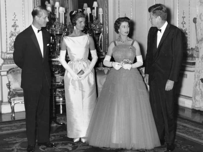 Queen Elizabeth wore a cobalt blue tulle dress when President John F. Kennedy and first lady Jacqueline Kennedy visited Buckingham Palace in 1961.