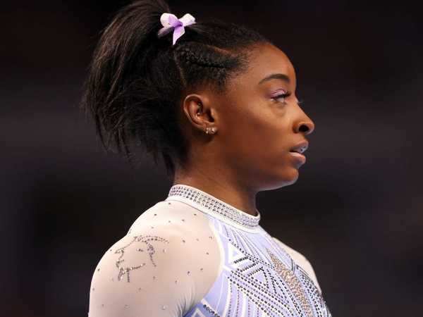 Simone Biles says she wears rhinestone 'GOAT' leotards to 'hit back at the haters' | Business ...