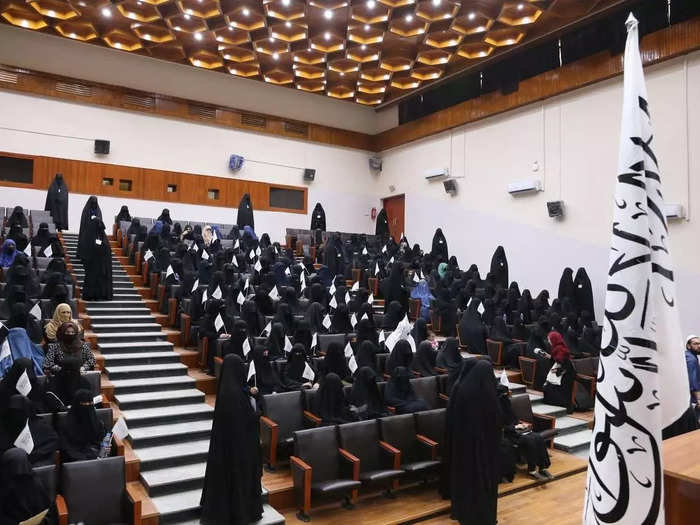 Veiled women attended an event in support of the Taliban's strict gender segregation policies.