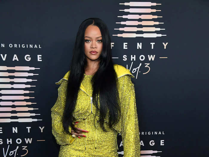 Rihanna wore a bedazzled minidress with a coordinating neon jacket to the premiere of her Savage X Fenty fashion show.