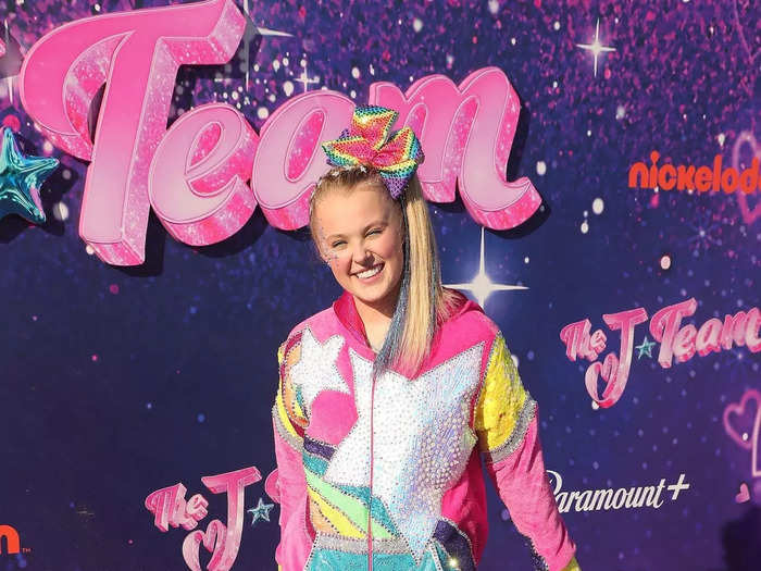 JoJo Siwa attended a screening of her latest movie in September 2021 while wearing a pink velour jumpsuit covered in a rainbow and star pattern.
