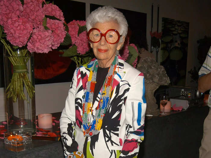 Iris Apfel wore a white longline blazer and pants with colorful artistic patterns to a garden party in 2006.