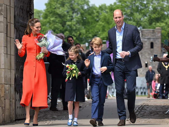 Prince William, Kate Middleton, Princess Charlotte, and Prince George waved to crowds as they visited Cardiff Castle in Cardiff, Wales, for the Queen's Platinum Jubilee celebrations.
