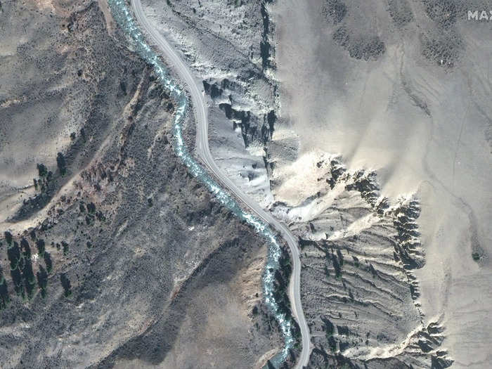 Satellite images give a bird's-eye view of the damage. The below image shows a road alongside the Gardiner River, south of the park's northern entrance, just a few weeks ago.