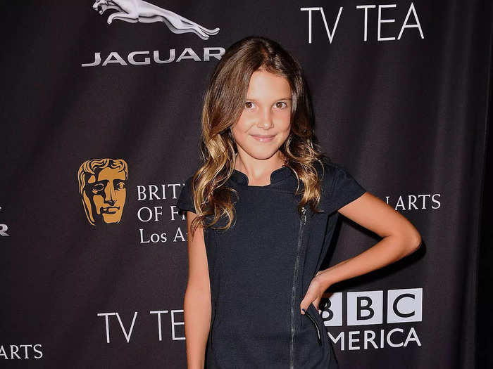 Millie Bobby Brown attended one of her first red carpets in 2014. Then 10 years old, she wore a simple dress with jewel-encrusted ballet flats.