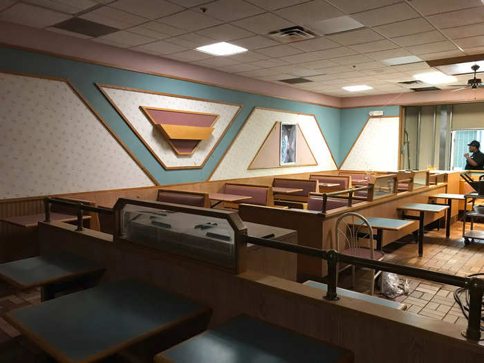 A Burger King restaurant has gone viral after photos and videos posted on social media show how it had preserved its 1980s and 1990s decor after being closed. The restaurant is hidden from the public behind a wall in Concord Mall in Wilmington, Delaware, that only staff can access with a key.