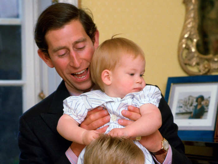 In 1985, King Charles III played with three-year-old Prince William and one-year-old Prince Harry at Kensington Palace. The cheeky photos showed Charles getting acclimated to fatherhood.