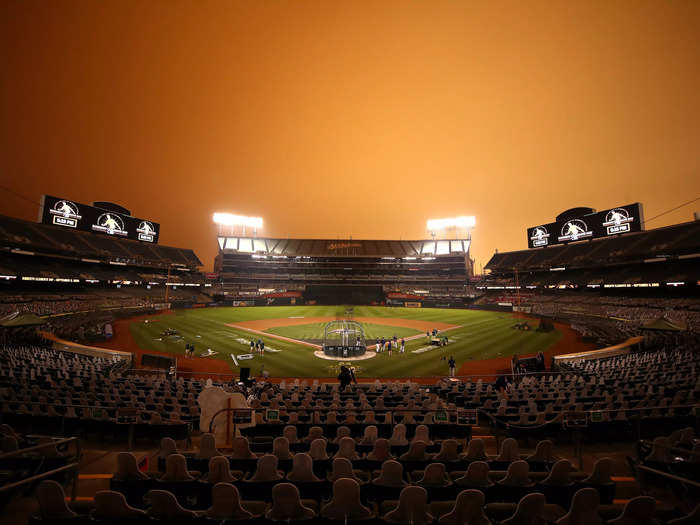 A baseball game is played under an eerie California sky
