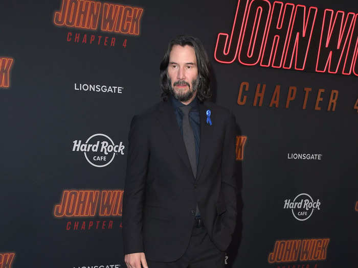 Keanu Reeves was dressed in a slick black suit, much like the one his titular hitman wears.