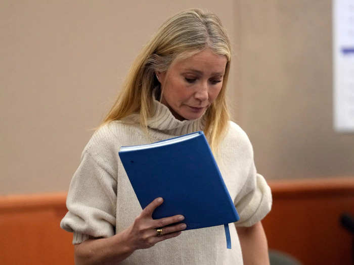 Paltrow wore a G. Label by Goop white knit turtleneck sweater on the first day of the trial
